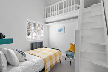 Paddle stairs in Bedroom Four leading to the mezzanine level.