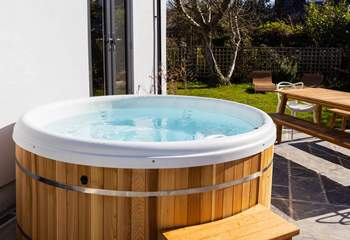 Enjoy the glorious cedar clad hot tub no matter the season.  