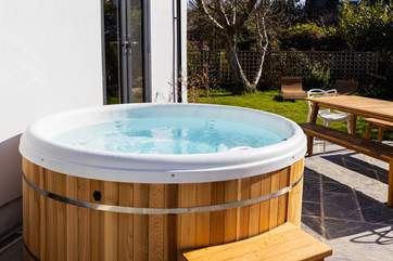 Enjoy the glorious cedar clad hot tub no matter the season.