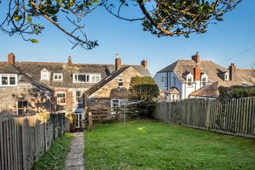 At the back of the property is a sunny garden and a lower terrace area for dining al fresco style