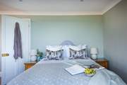 Bedroom five is another spacious room, set on the second floor.