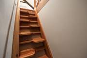 Paddle stairs lead up to the snug - the door accessing the stairs can be locked if required.