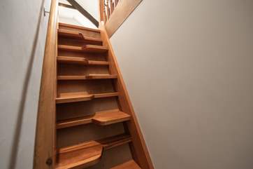 Paddle stairs lead up to the snug - the door accessing the stairs can be locked if required.
