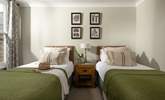 Lovely muted tones in the twin bedroom. - Thumbnail Image