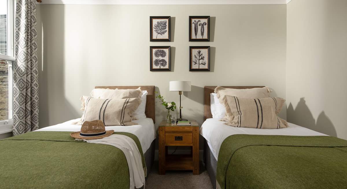 Lovely muted tones in the twin bedroom.