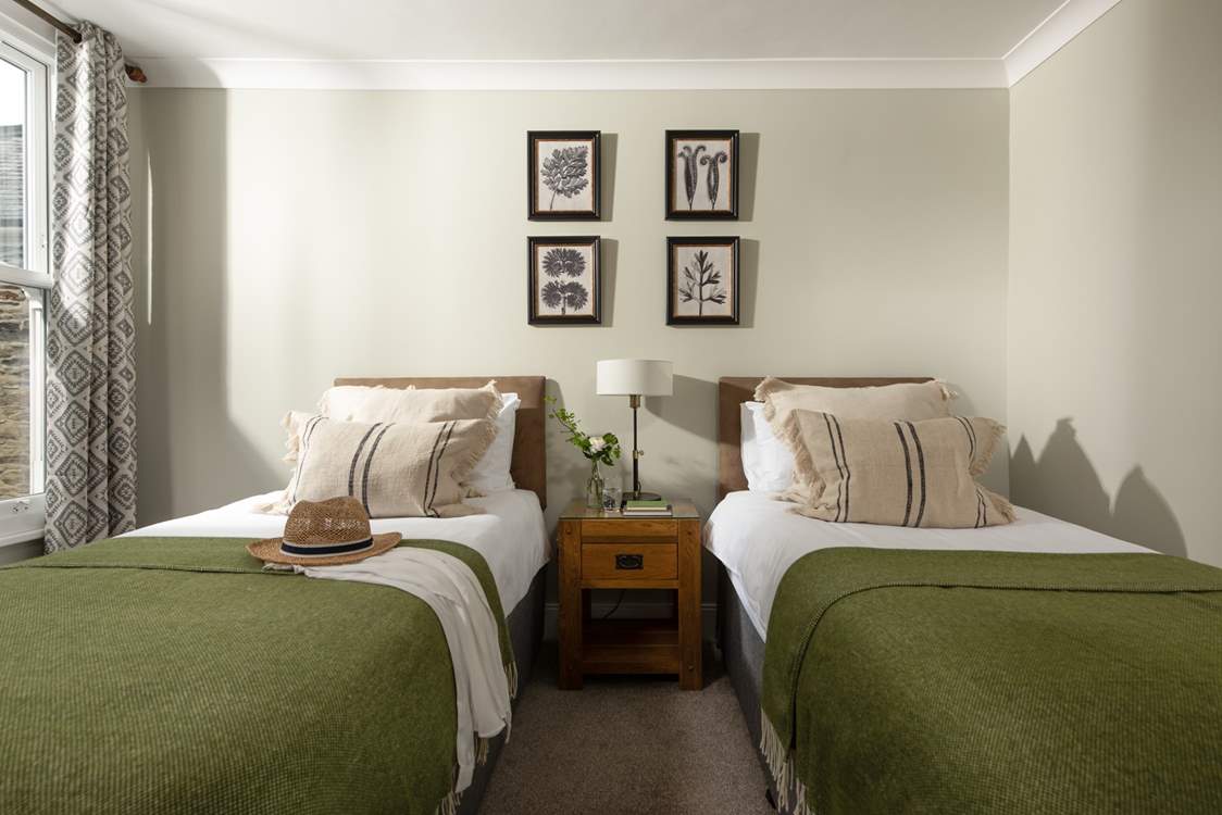 Lovely muted tones in the twin bedroom.
