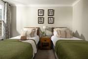 Lovely muted tones in the twin bedroom.