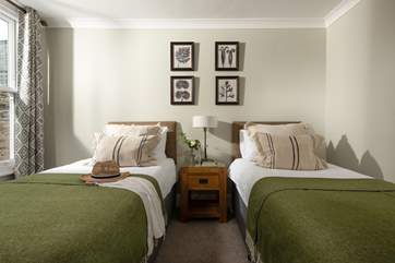 Lovely muted tones in the twin bedroom.