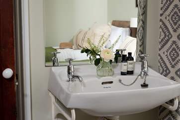 There is a little vanity unit in the bedroom.