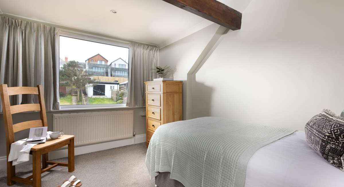 This lovely single room sits at the back of the house, looking out over the garden.