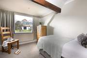 This lovely single room sits at the back of the house, looking out over the garden.