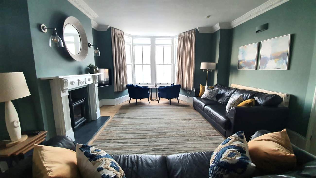 The sitting/dining-room takes pride of place at the front of the house.