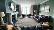 The sitting/dining-room takes pride of place at the front of the house.
