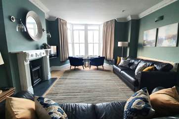 The sitting/dining-room takes pride of place at the front of the house.