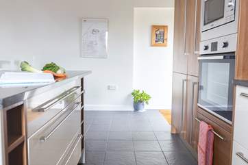 The kitchen area provides a second exit/entrance. Just round the corner (as detailed in the previous image), you will find the door which takes you to the top of the courtyard steps.