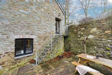 Step outside of the kitchen, you will arrive at the top of these stone steps. Please take care when using the steps, as may prove slippy following rain.