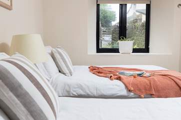 Bedroom two looks out onto your walled courtyard.