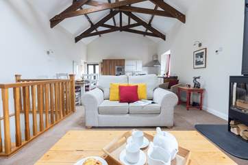 The open plan layout makes dining, cooking, and relaxing together a real pleasure.