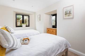Bedroom two looks out onto your walled courtyard.