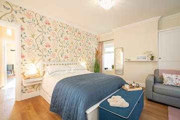 The bedroom showcases lovely decor.