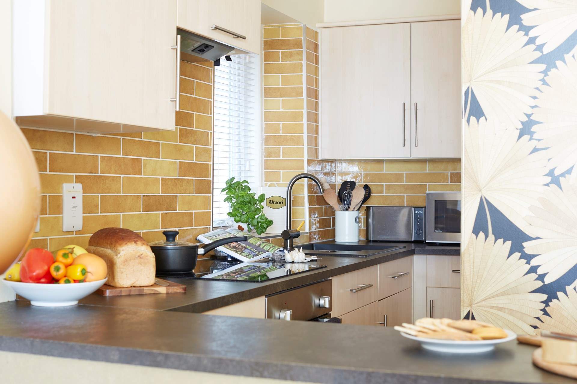 The breakfast-bar and kitchen is cleverly laid out. 
