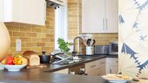 The breakfast-bar and kitchen is cleverly laid out. 