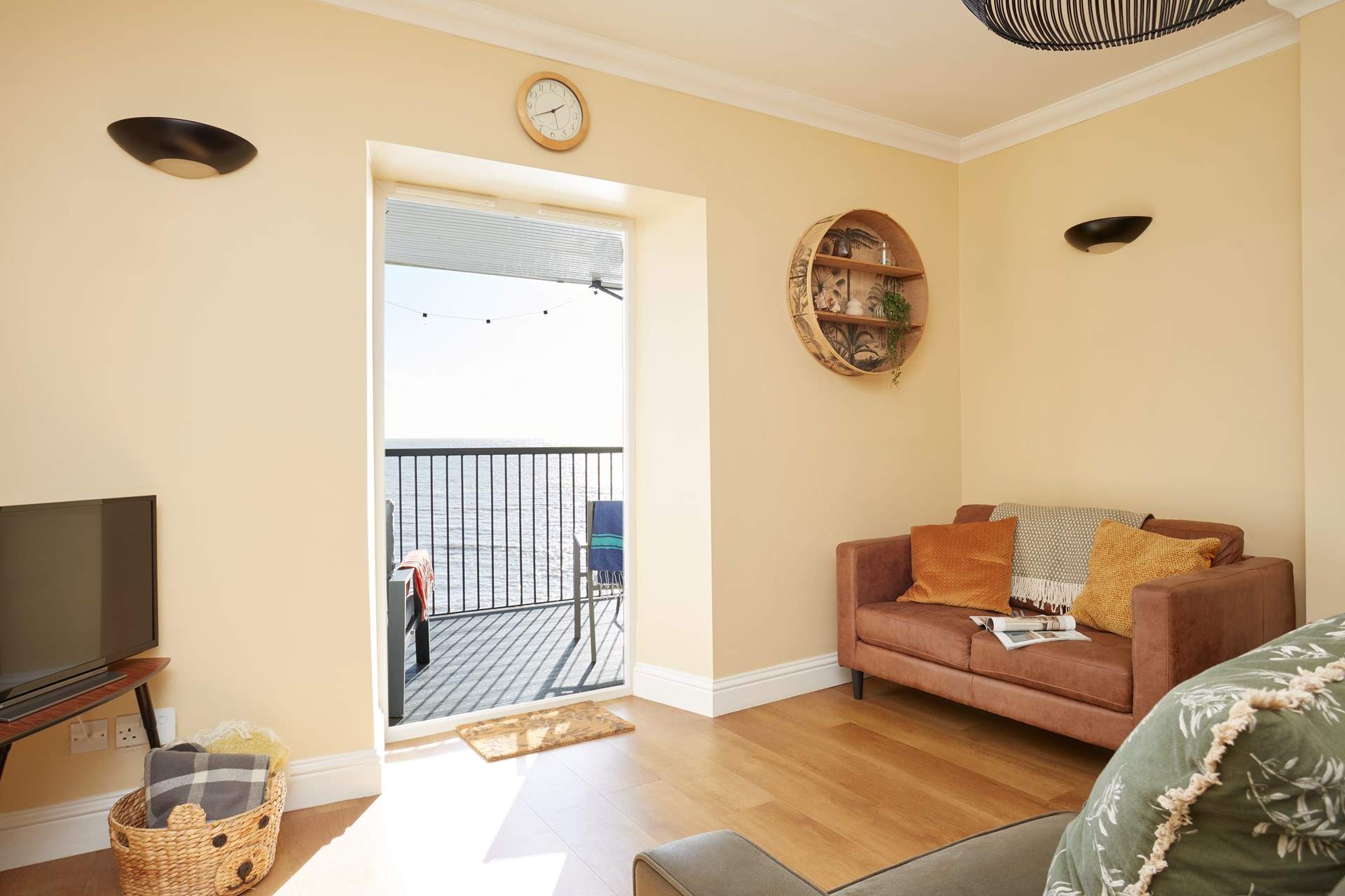 The modern style open plan living-room with views of the sea.