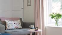 The oversized arm chair is a comfortable spot to curl up with a good book.