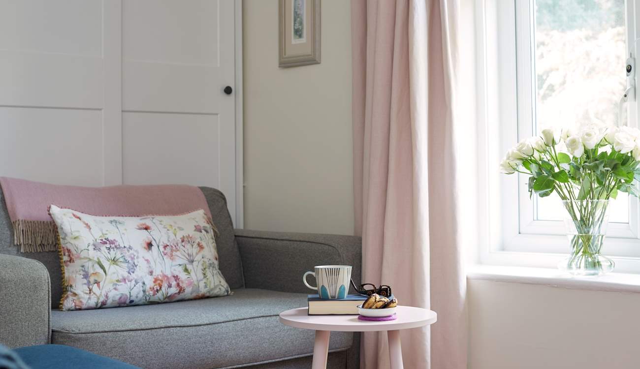 The oversized arm chair is a comfortable spot to curl up with a good book.