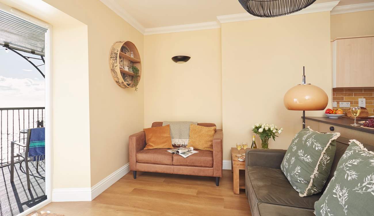 The comfortable living area with views of the sea.