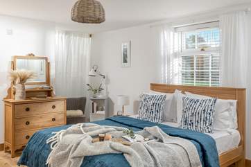The bedroom is beautifully decorated.