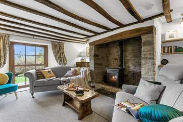 With exposed beams and splendid feature fireplace, settle in for a cosy night in front of the fire.