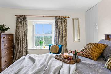 The main bedroom is delightful.