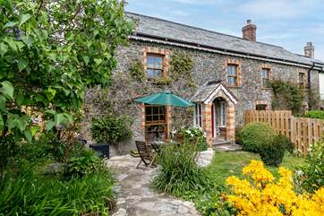 The gorgeous back garden at Greystones is the perfect place to relax on holiday.