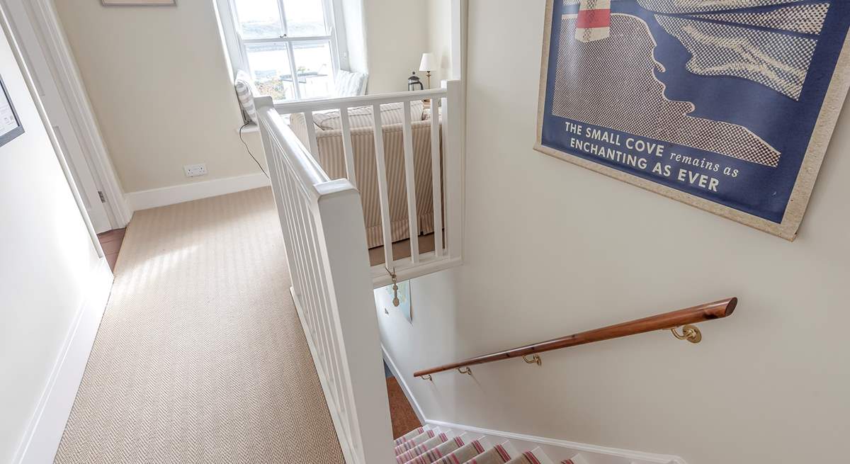 The staircase to the first floor bedrooms and bathroom.