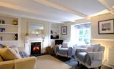 Relax in front of the wood-burner in cooler months. - Thumbnail Image