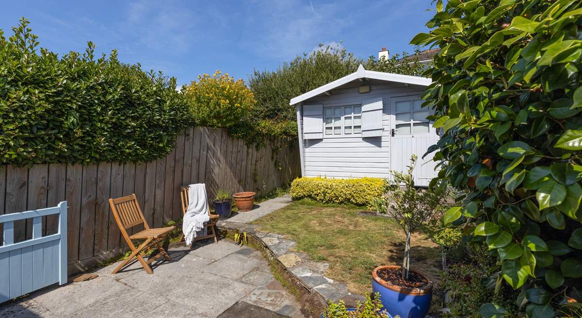 The secluded rear garden is the perfect spot for a quiet read.