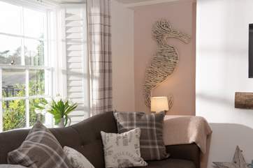 The beautiful sash windows let the light flood in