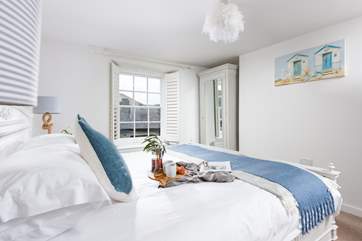 Bedroom One has been decorated in restful shades of blue and grey