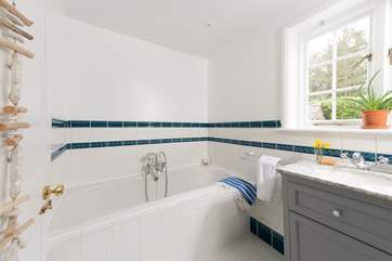 The family bathroom invites you to enjoy a leisurely holiday soak
