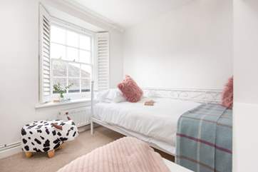 The fourth bedroom is such a pretty room