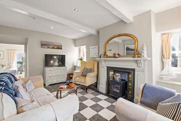 The sitting-room leads into the kitchen/diner.