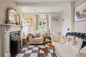 Snuggle down in the sitting-room to watch the Smart TV after a busy beach day.