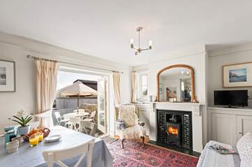 The dining-area has the perfect combination of a wood-burner for cooler days and access to the gorgeous patio for summer al fresco dining.