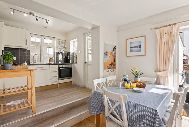 Up two steps from the dining-area, the kitchen has all you need to create a holiday feast.