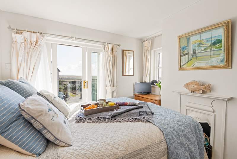 Dressed with gorgeous linens, bedroom 1 has a fabulous balcony, perfect for your first cuppa of the day.
