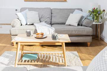 The comfy sofa invites you to sit back and relax after a day of exploring.