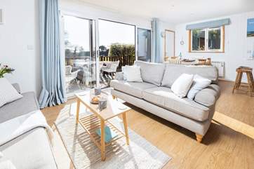 Light and airy, the living space is decorated in calming pastel shades.