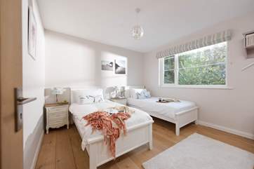 Bedroom Two is a very sweet room with twin beds.