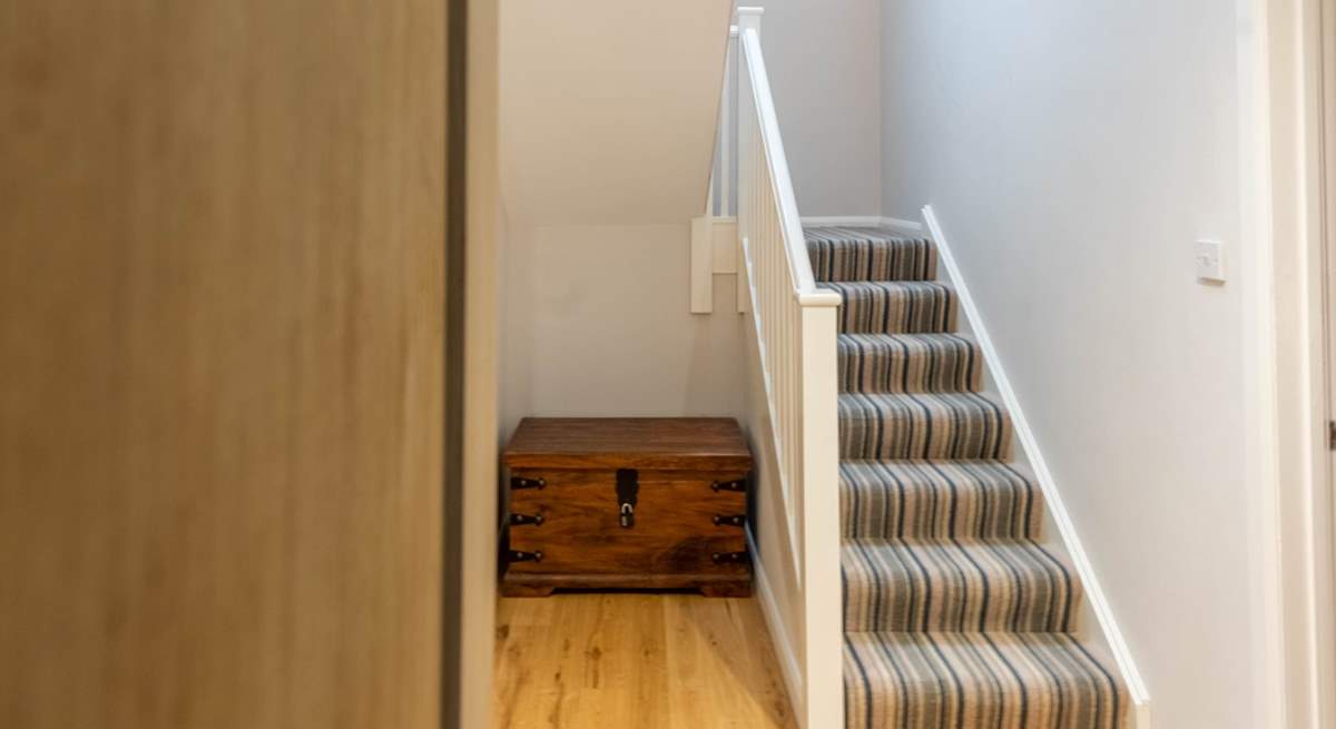 Stairs take you up to the first floor landing and further two bedrooms. 